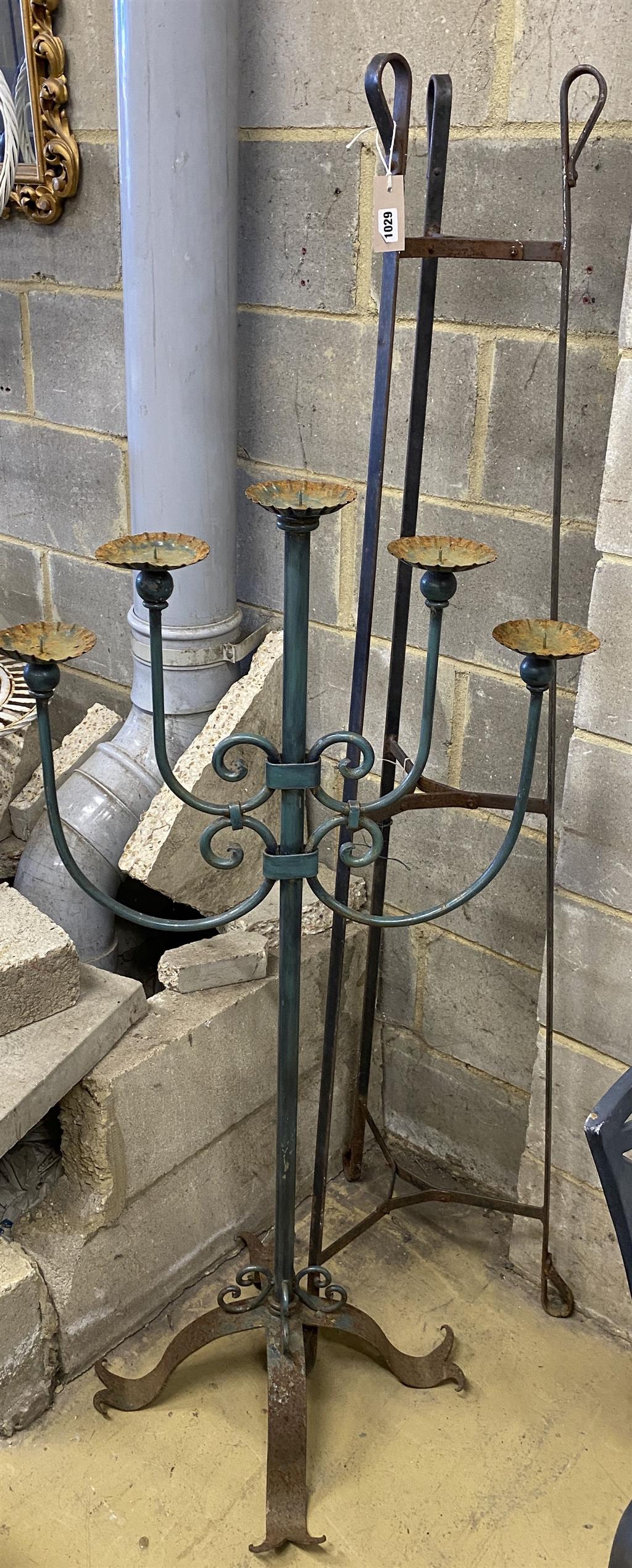A wrought iron pot stand and large wrought iron five branch floor standing pricket candlestick, candlestick 126cm high